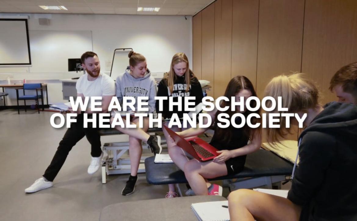 Six students in nursing suite with text 'We are the school of health and society' 