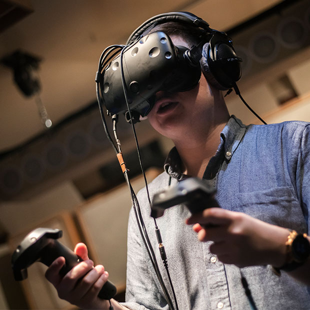 A student using a Virtual Reality headset