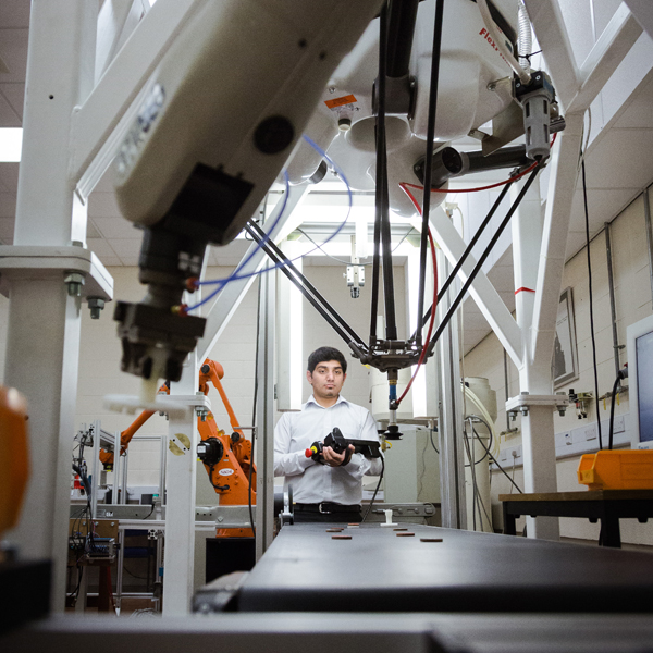 Student operating equipment in the NERIC Building at the University of Salford