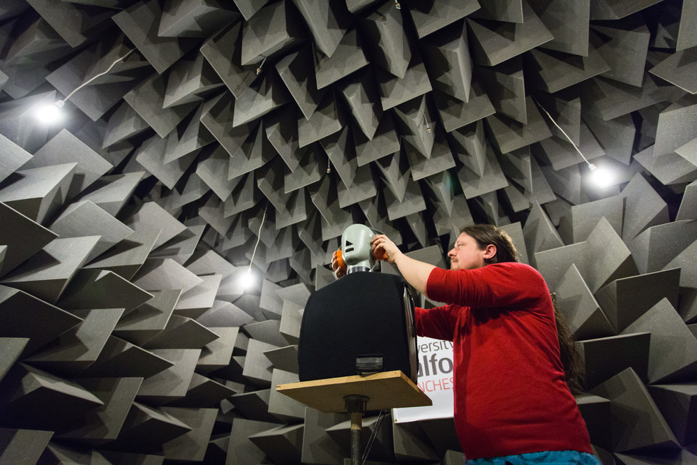 Student setting up an experiment in the anechoic chamber, University of Salford