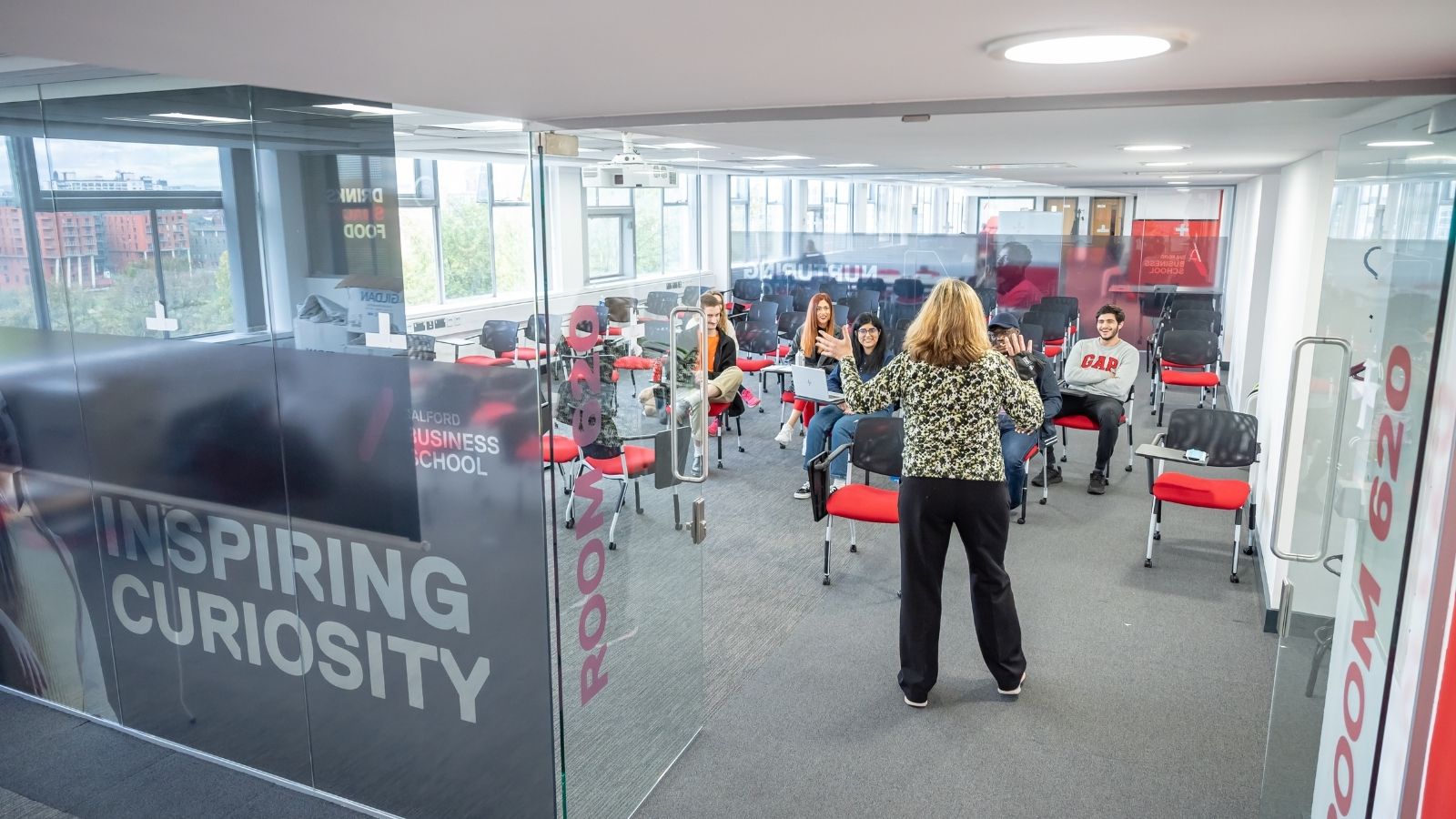 Salford Business School students in glass classroom