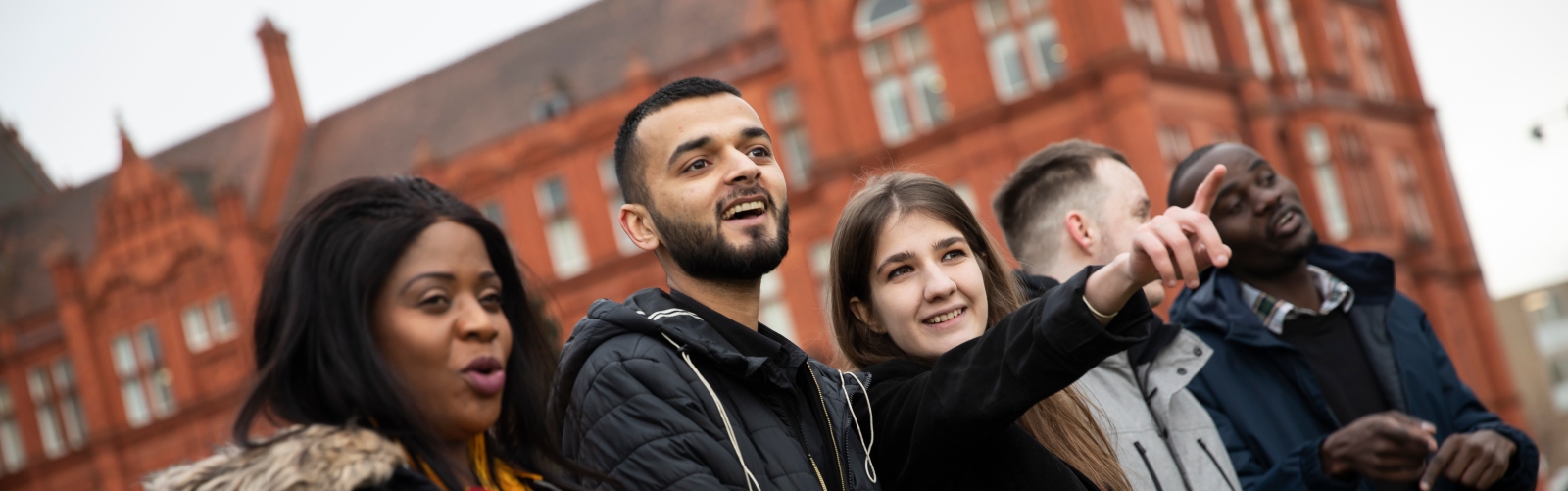Salford's international students outside Peel building