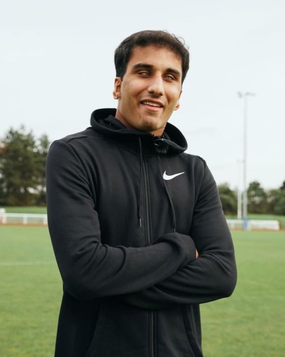 A photograph of Azeem Amir in a sports field.