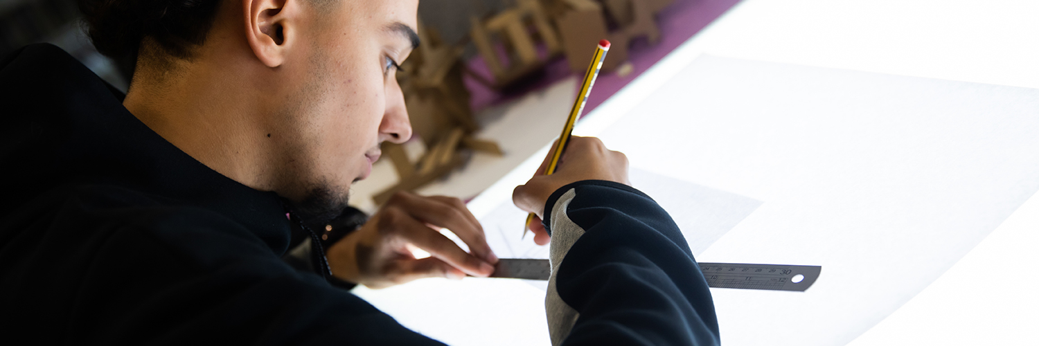 Student working at an architecture lightbox