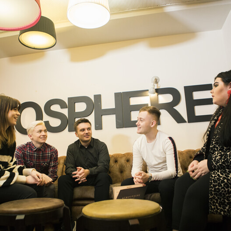 Students sat talking in Atmosphere bar and kitchen