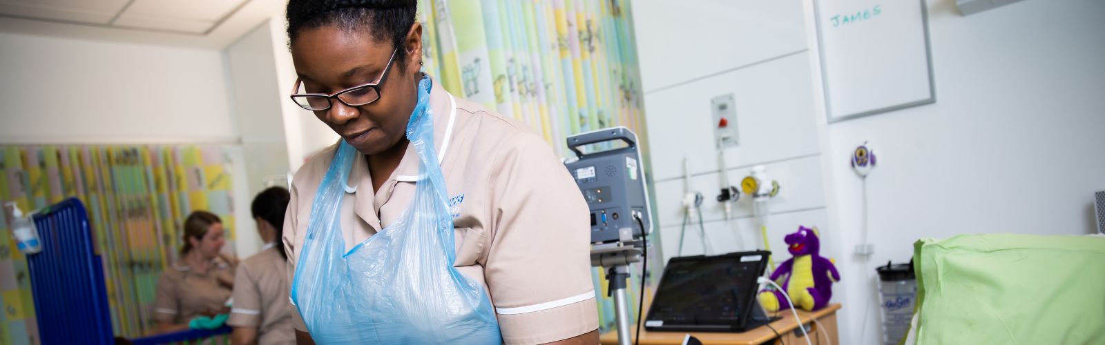 Trainee Nursing Associate (TNA) working in a hospital ward