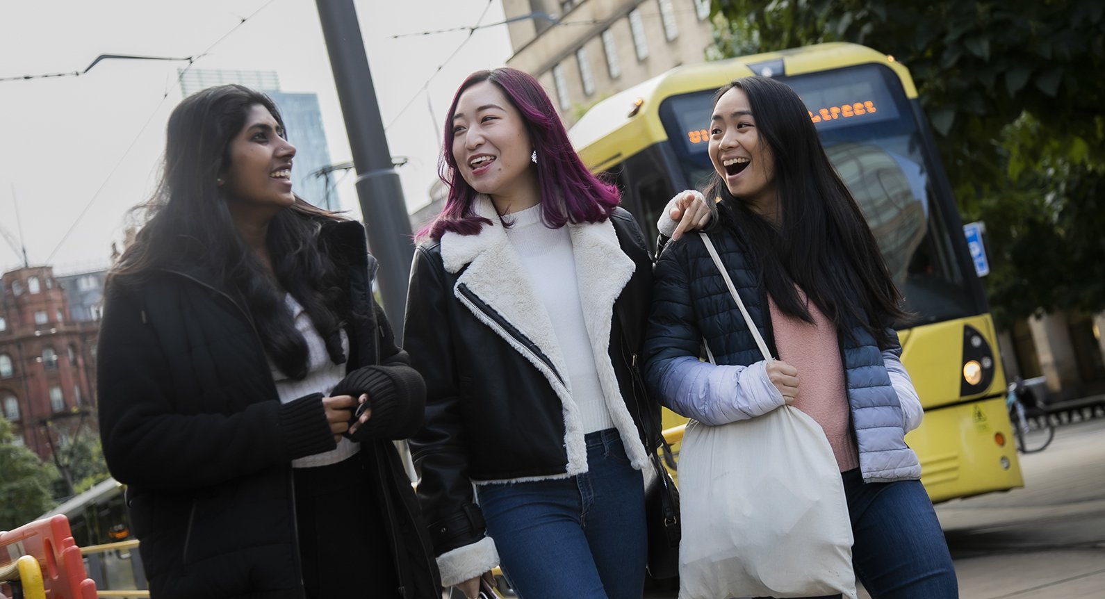 Young women laughing and having fun in the city