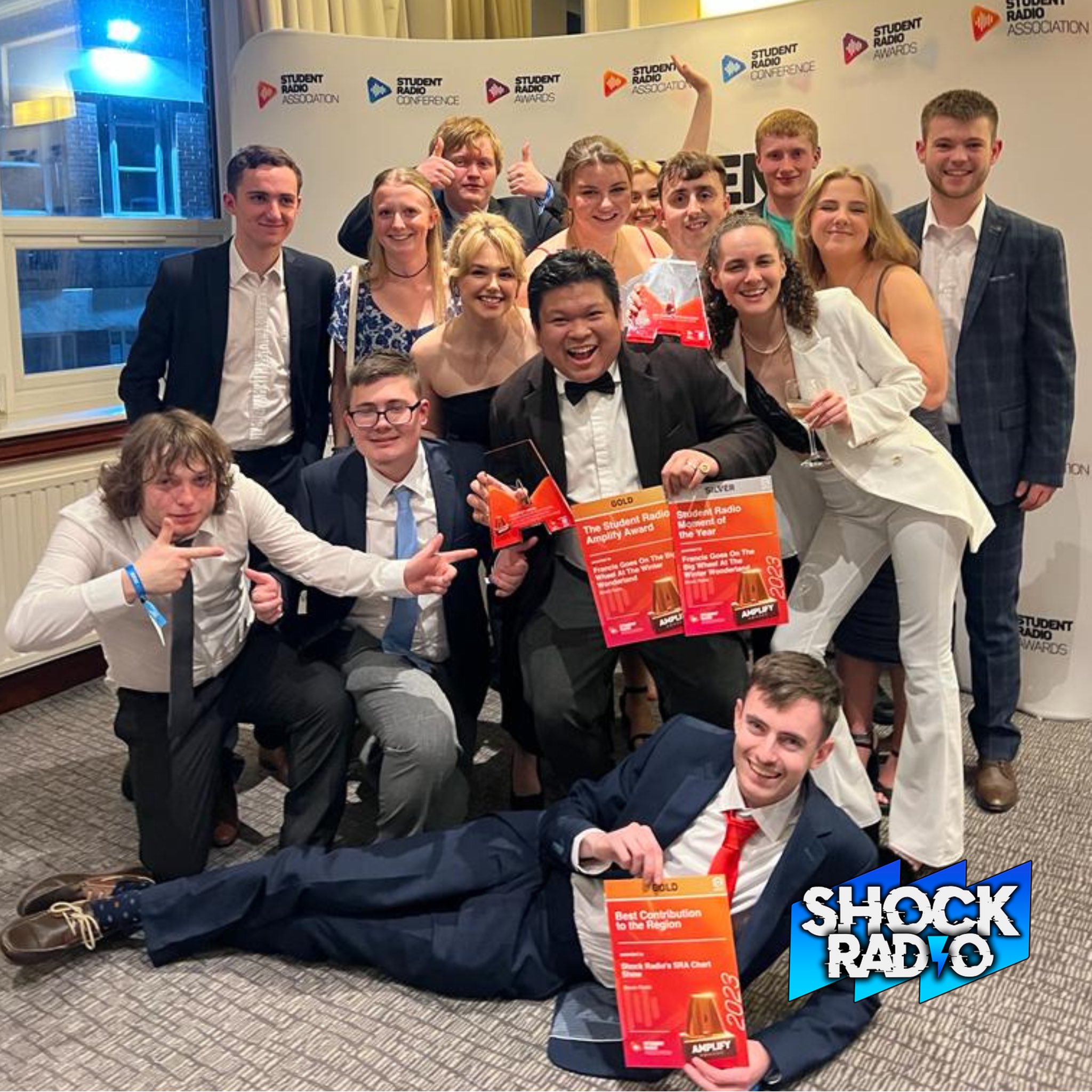 Shock Radio team celebrating after their win at the SRA Amplify awards.
