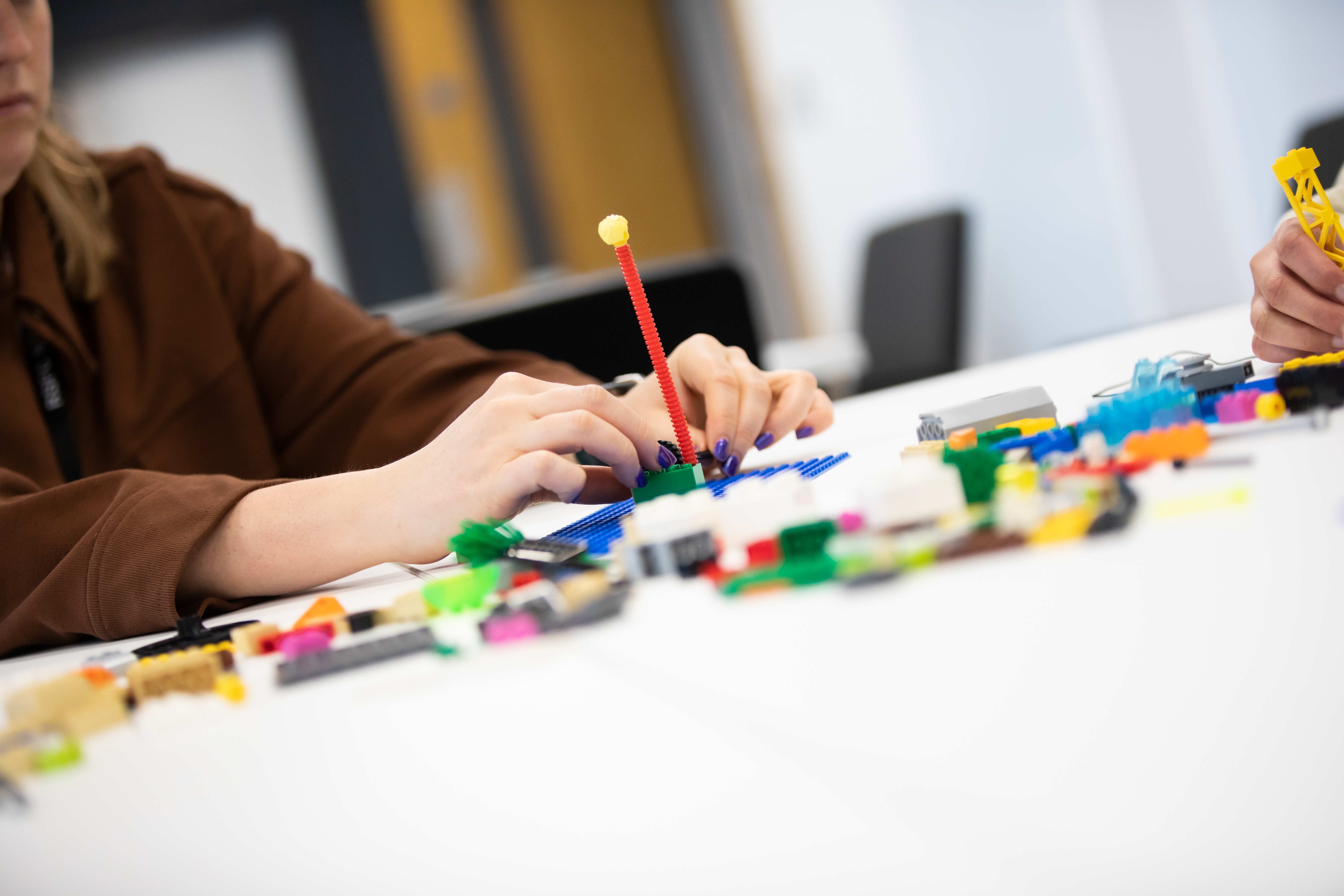 Student playing with lego
