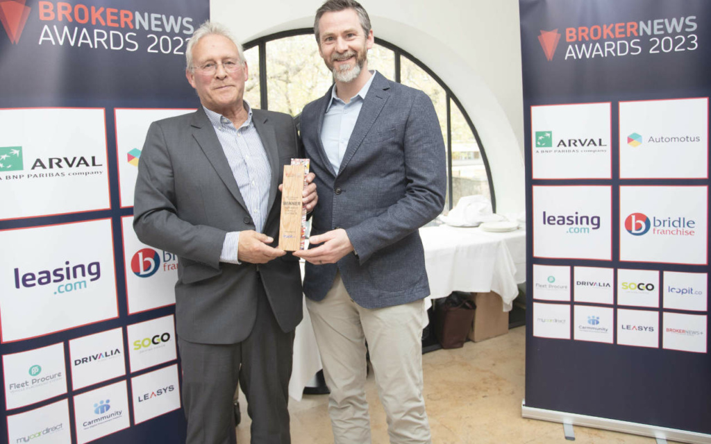 Keith Hawes, Director of Nationwide Vehicle Contracts receives the Innovation in Broking Award trophy from Loopit’s Andrew Mortimer