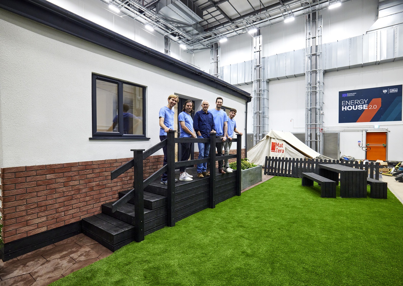 Five people stood outside a Vector Home inside Energy House 2.0