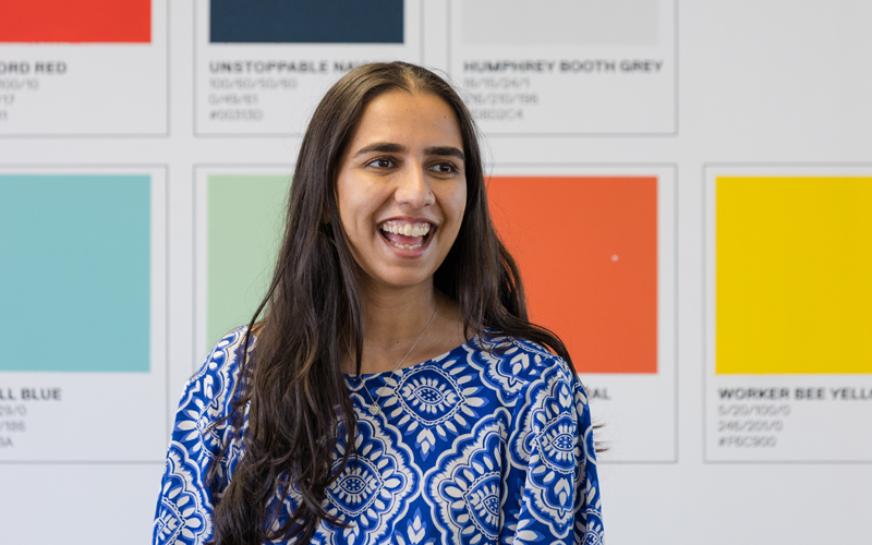 Office colleague sat in front of a colour printers chart