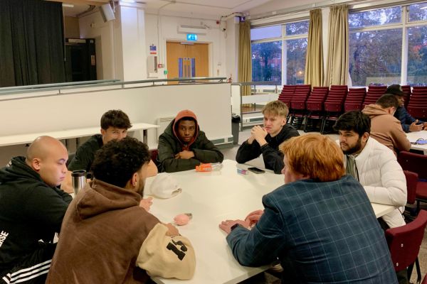 Students discuss ideas at Young Enterprise meeting