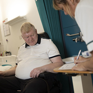 man sat in chair