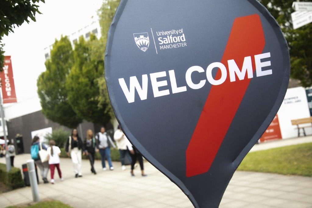 Welcome spinner signage at the University of Salford