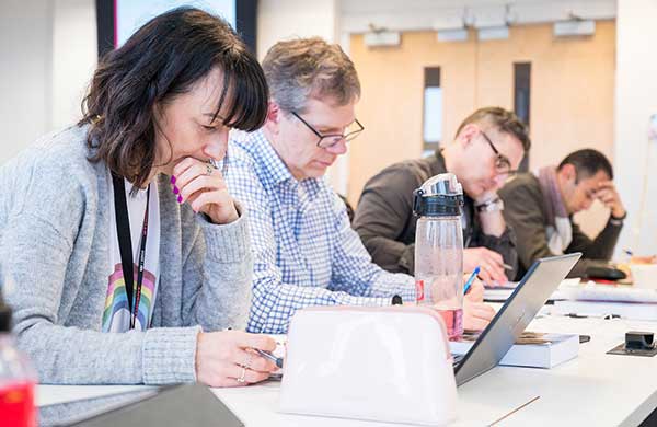 Mature students engaged in a focused training session