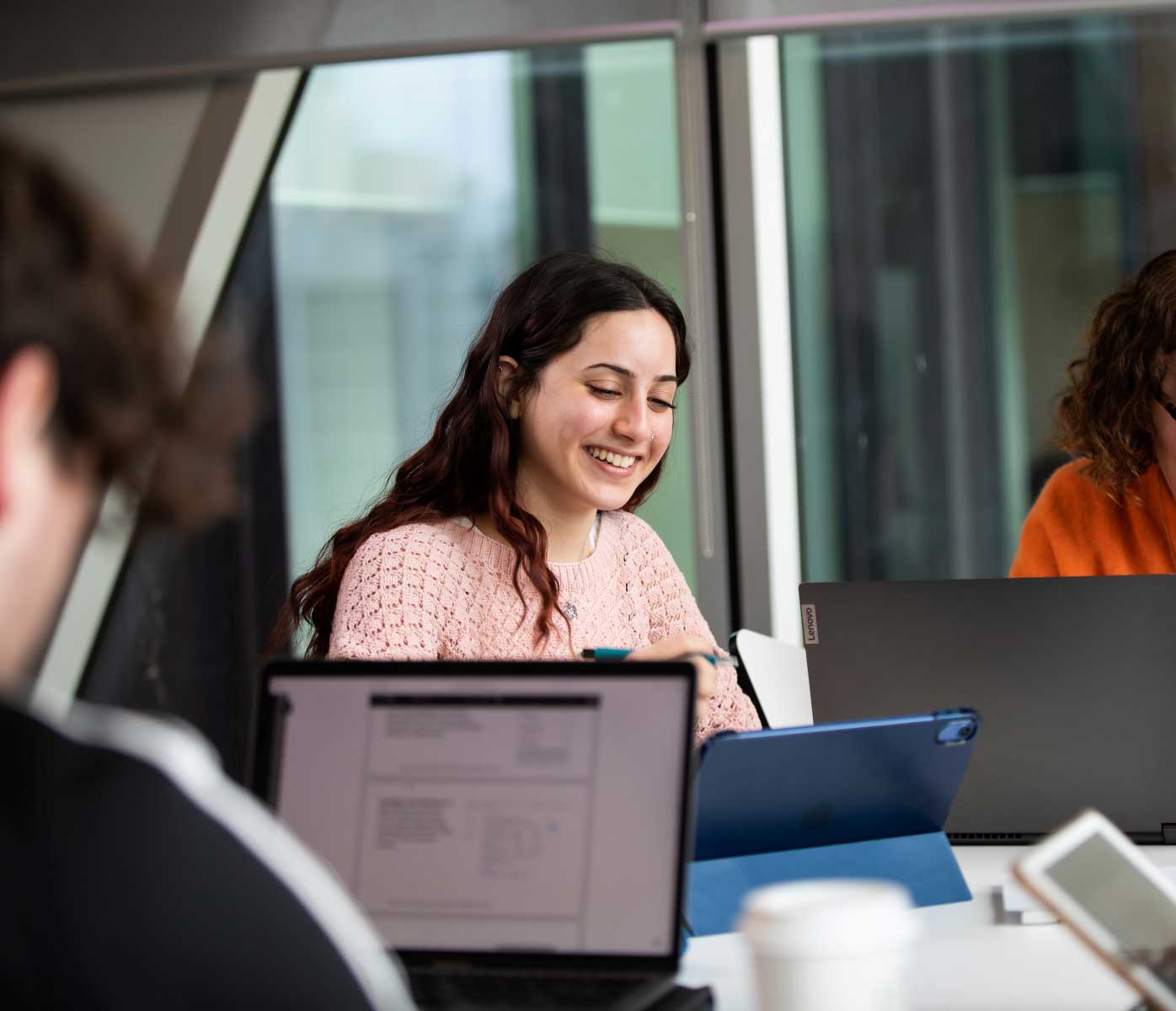 A group of students studying with laptops