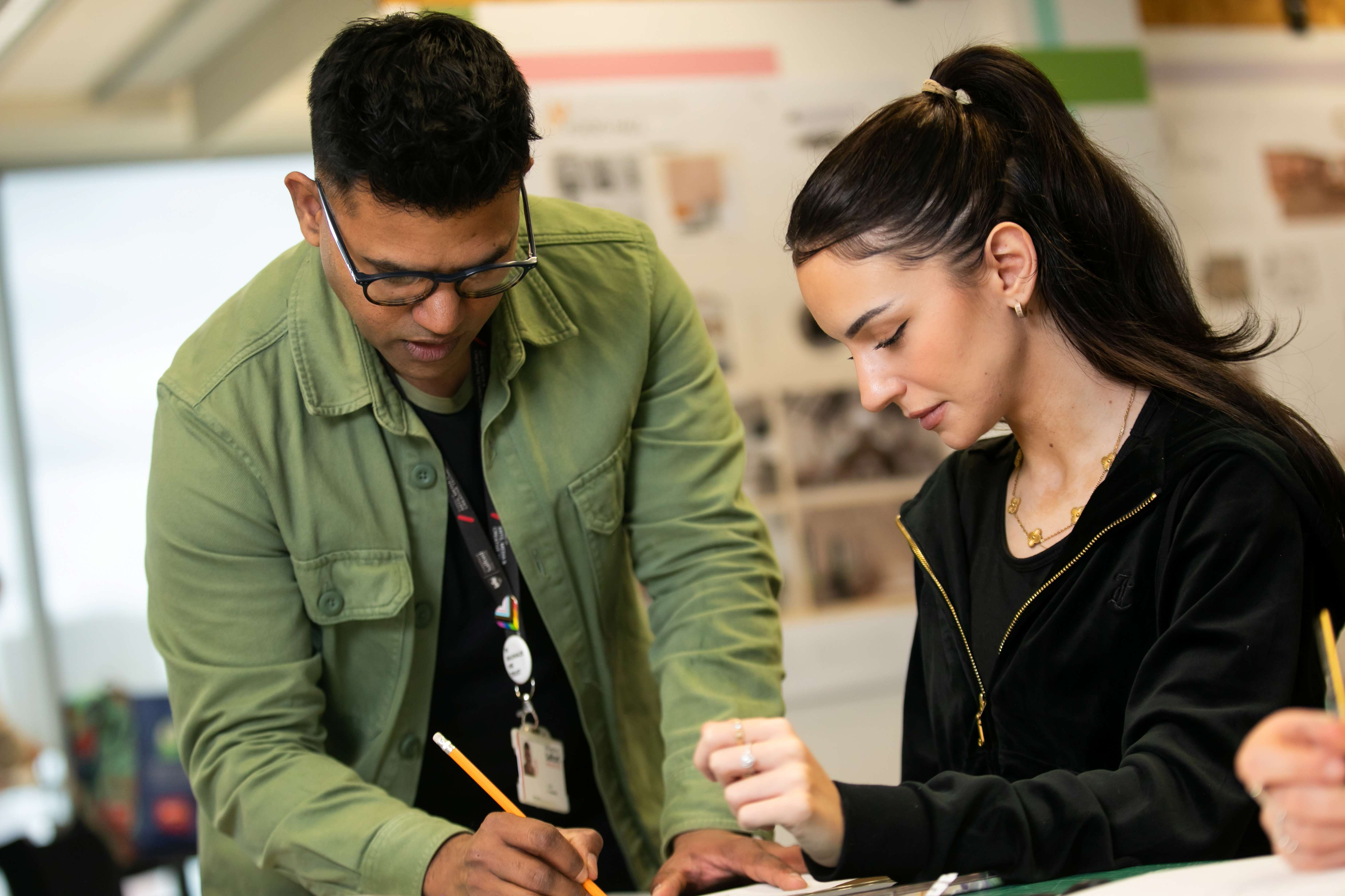 Interior design student and tutor working on project