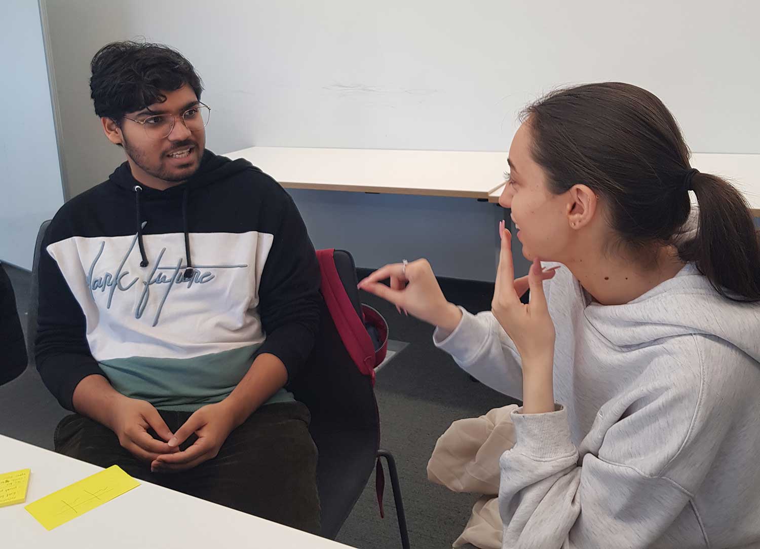 Two students talking at a PALS session