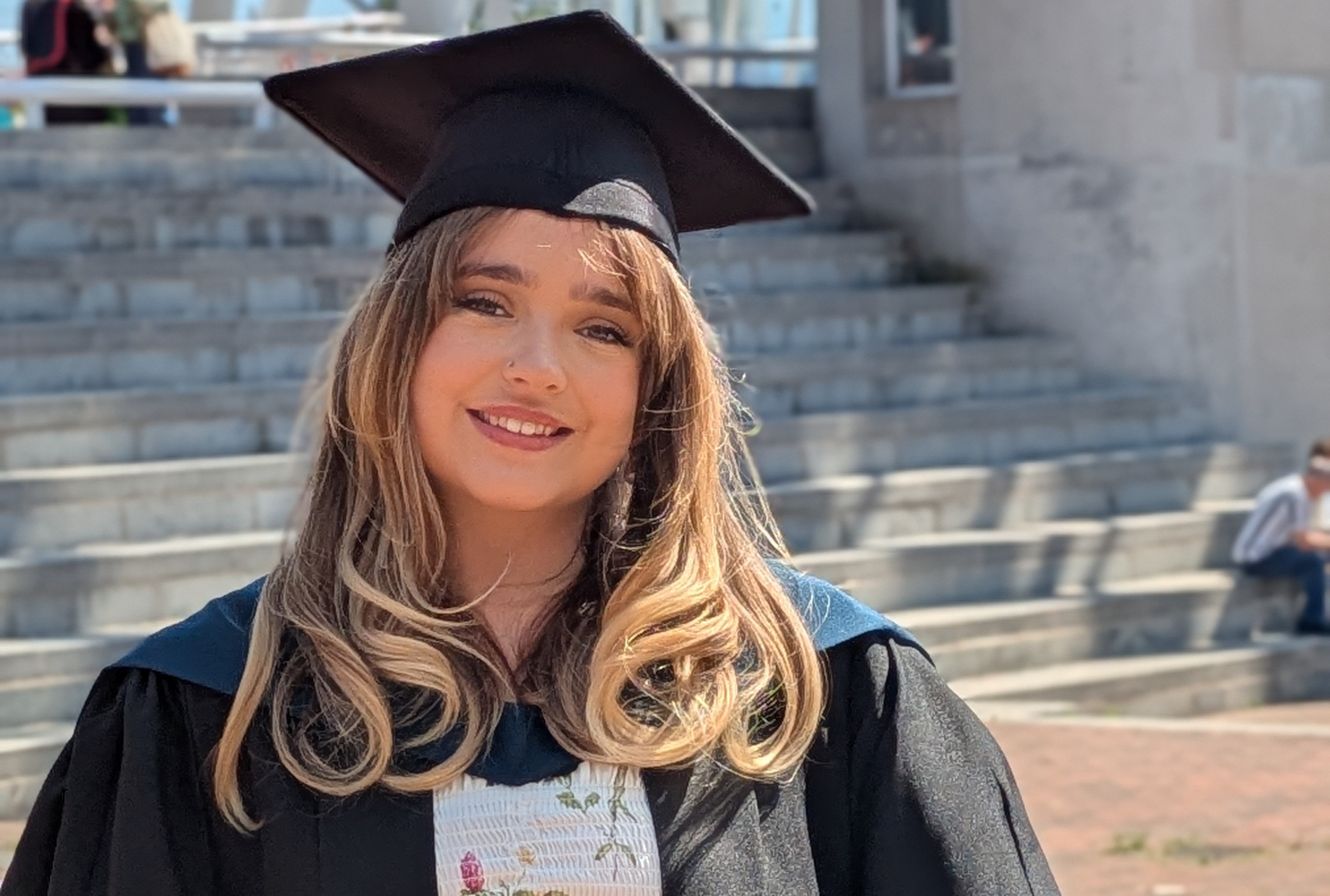Phoebe Hall in her graduation cap and gown
