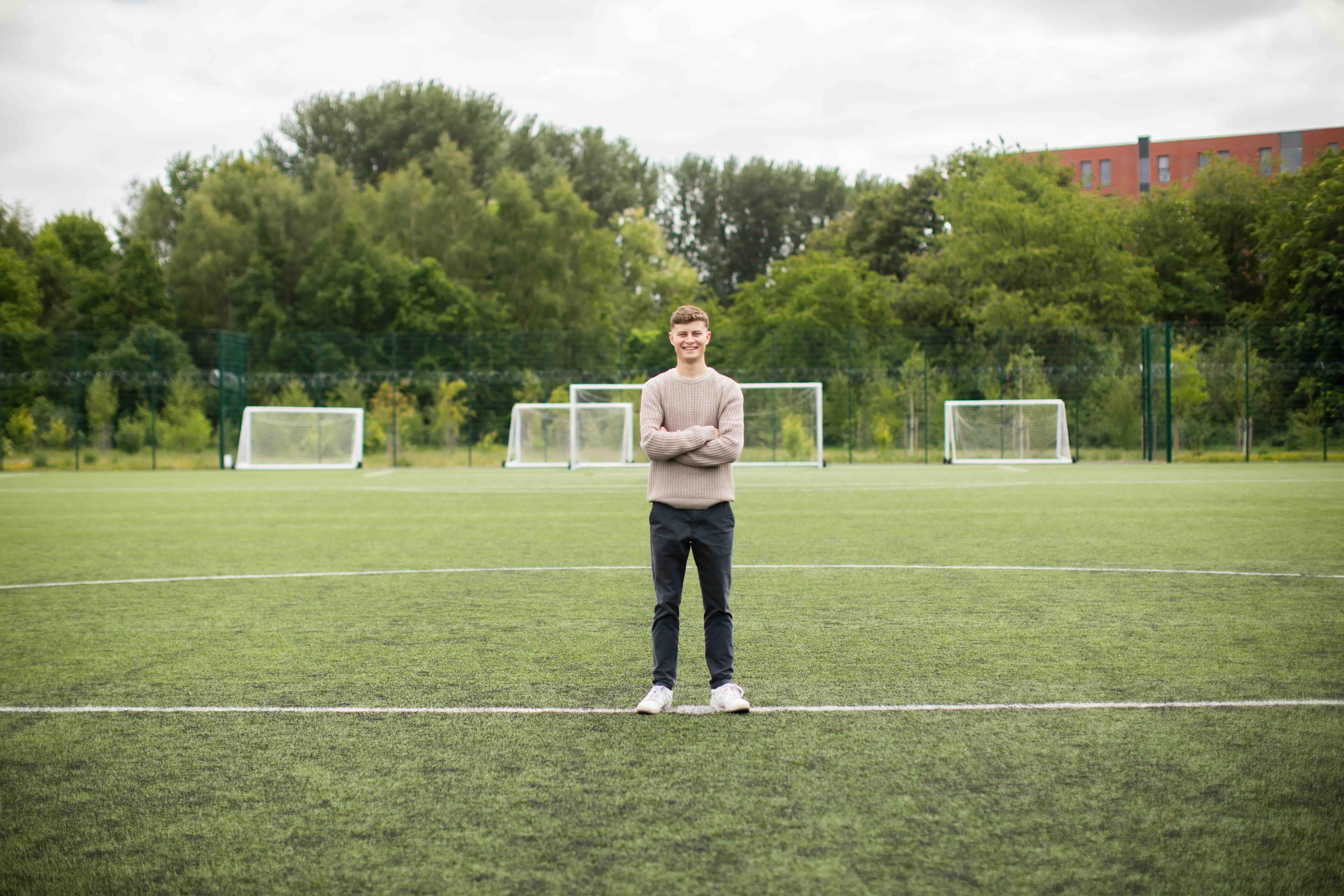 Journalism Broadcast student Max on the 4G pitch at the University of Salford