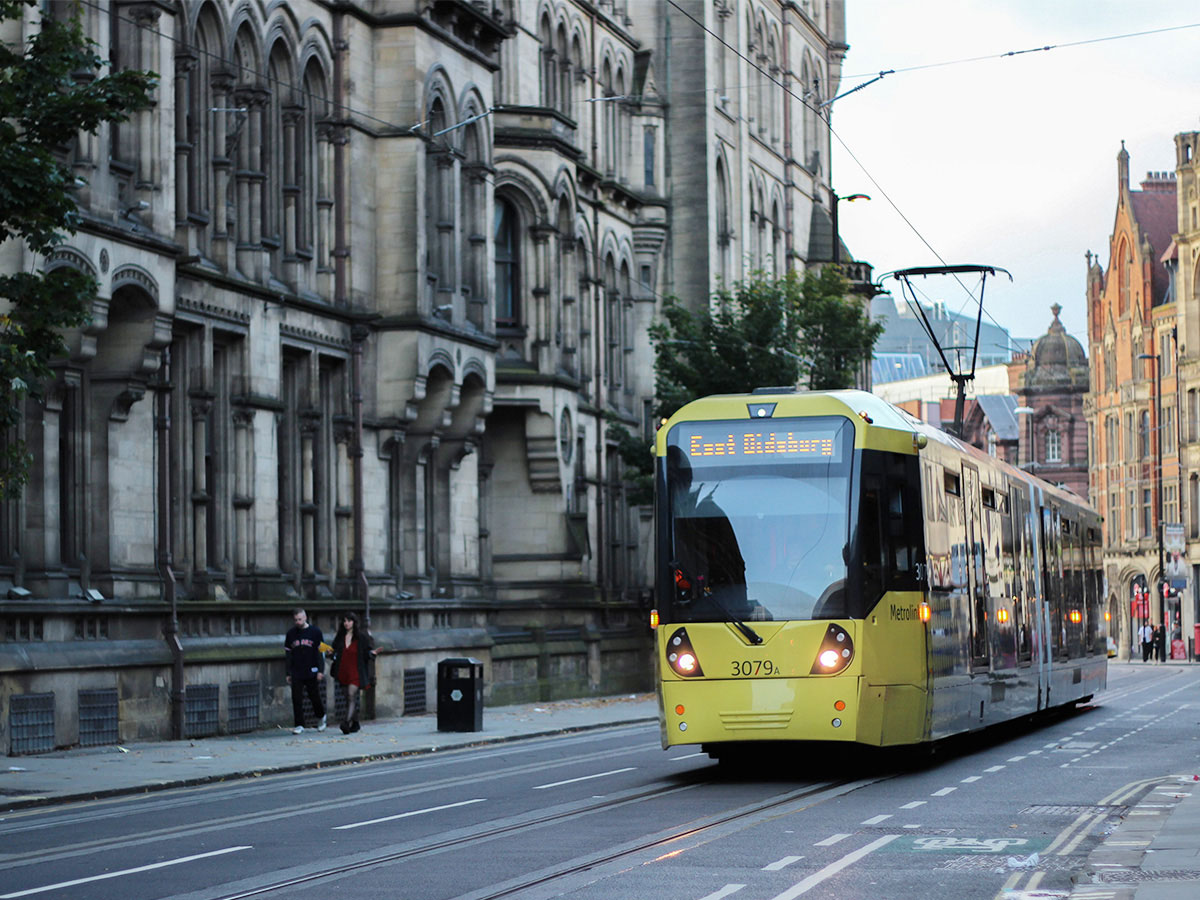 Tram travelling through Manchester city centre