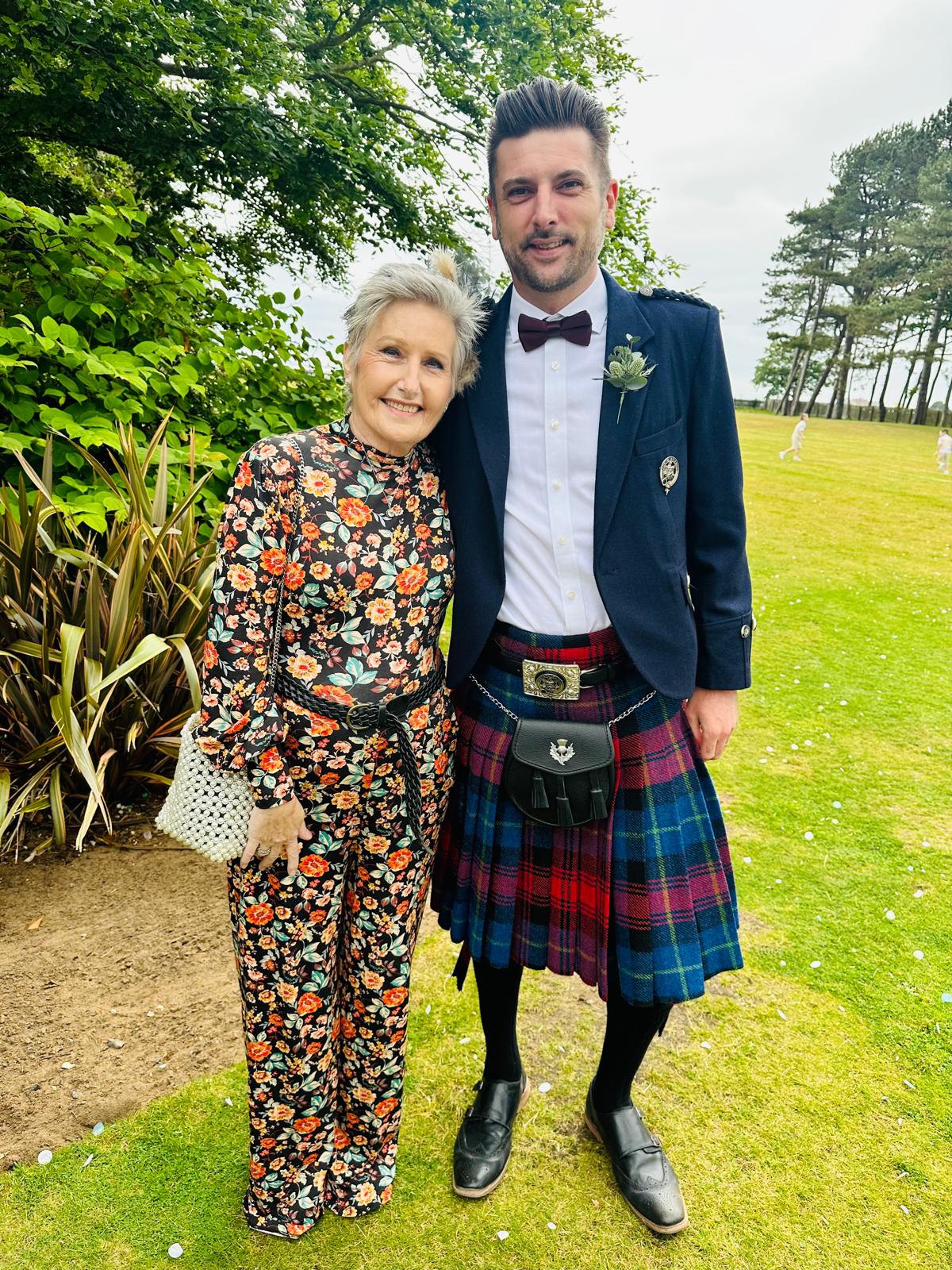 Lecturer Jimmy Ewing in a kilt with his mum Anne