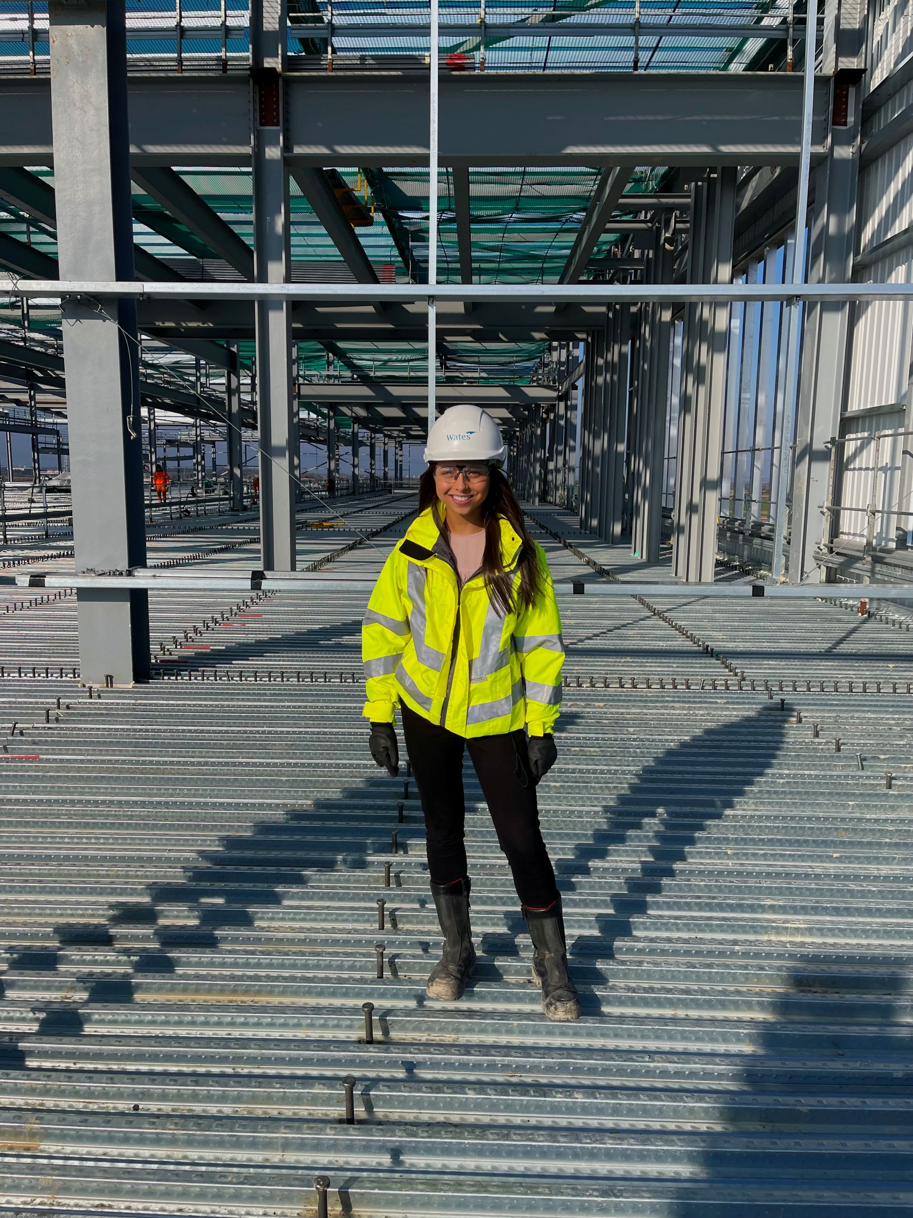 Hannah Daly in hardhat and hi-vis - BSc (Hons) Quantity Surveying 