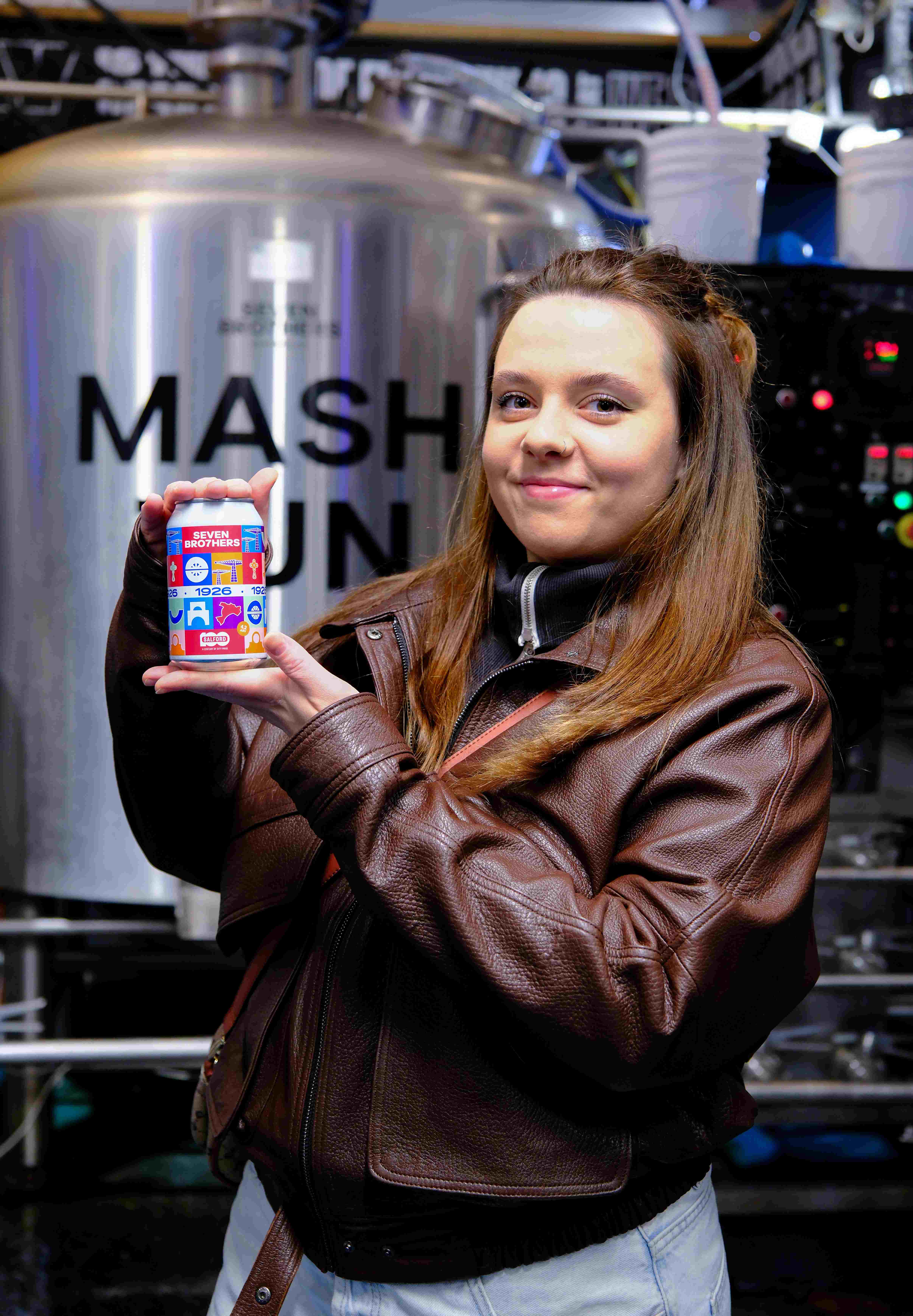 Anhelina holds the Seven Brothers can which she designed the label for