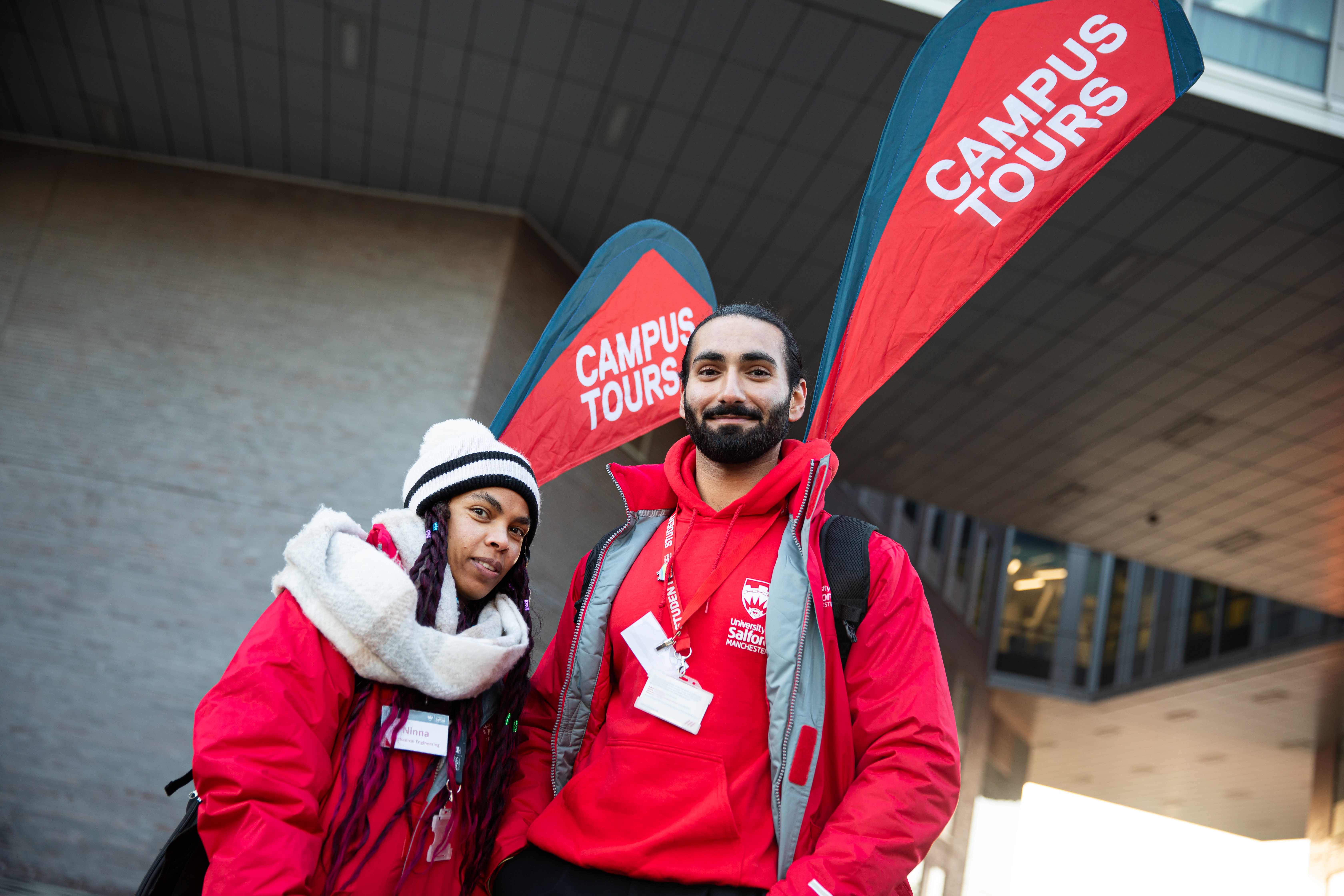 Two student ambassadors advertising a campus tour