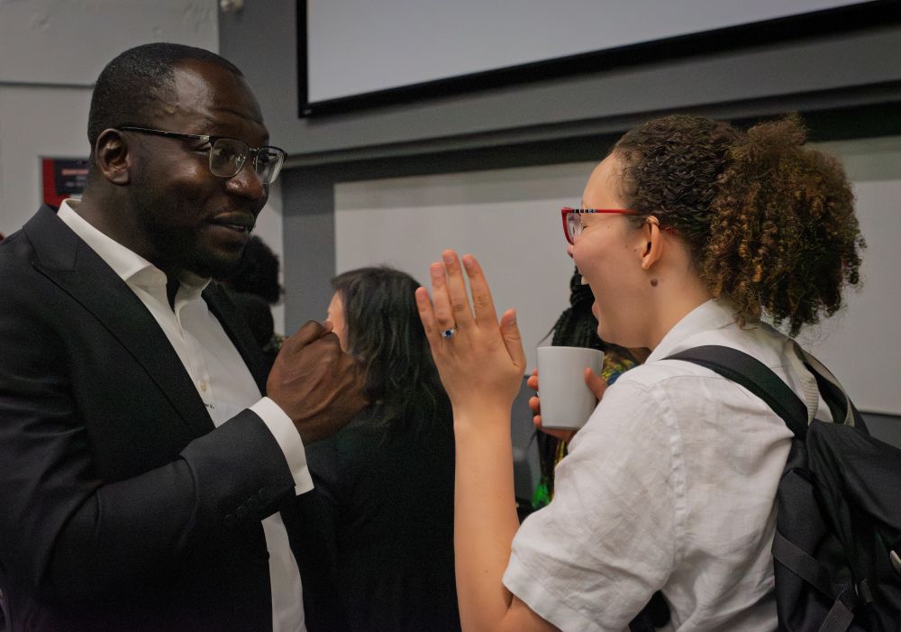 Postgraduate students networking at the conference