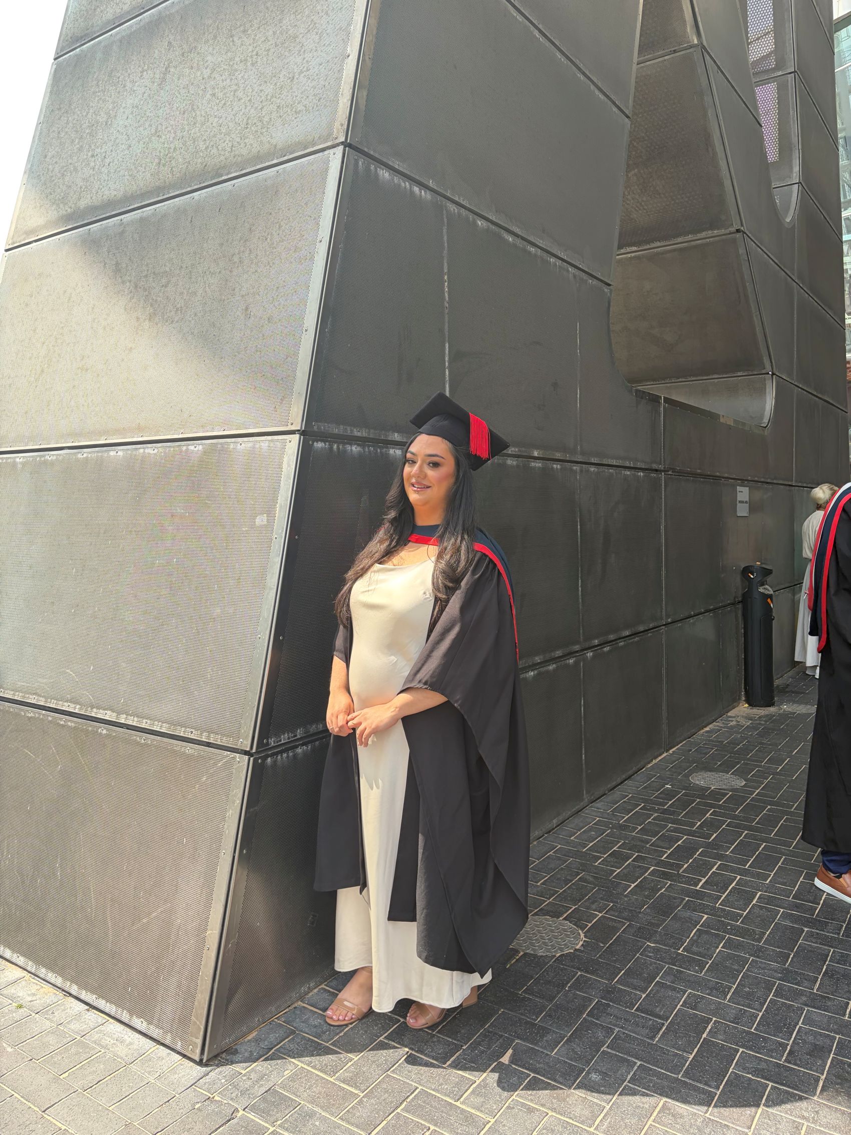 Samaira is pictured in her graduation cap and gown
