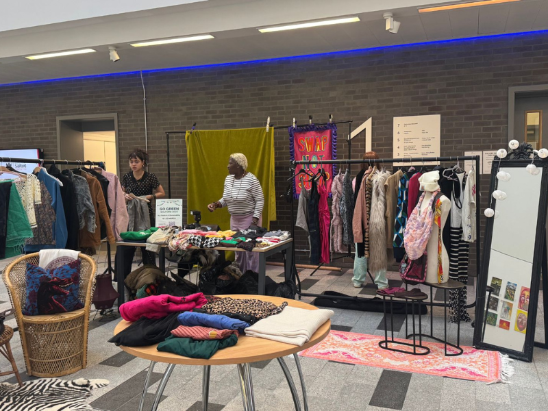 A pop-up clothing swap and sustainability stall hosted during Go Green Salford at the University of Salford
