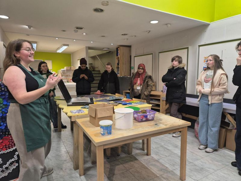 Indoor classroom where an instructor is leading a group of young people