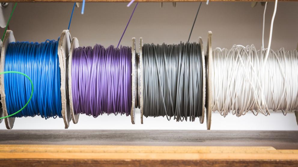Four different colours of cabling on drums