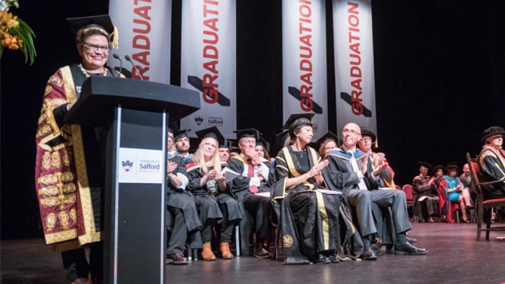 On stage during a graduation ceremony