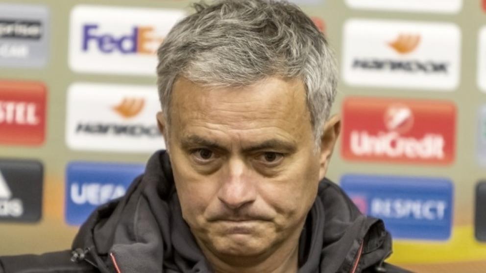 Jose Mourinho against a backdrop of sponsor logos