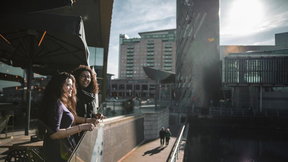 Students on a balcony at MediaCity