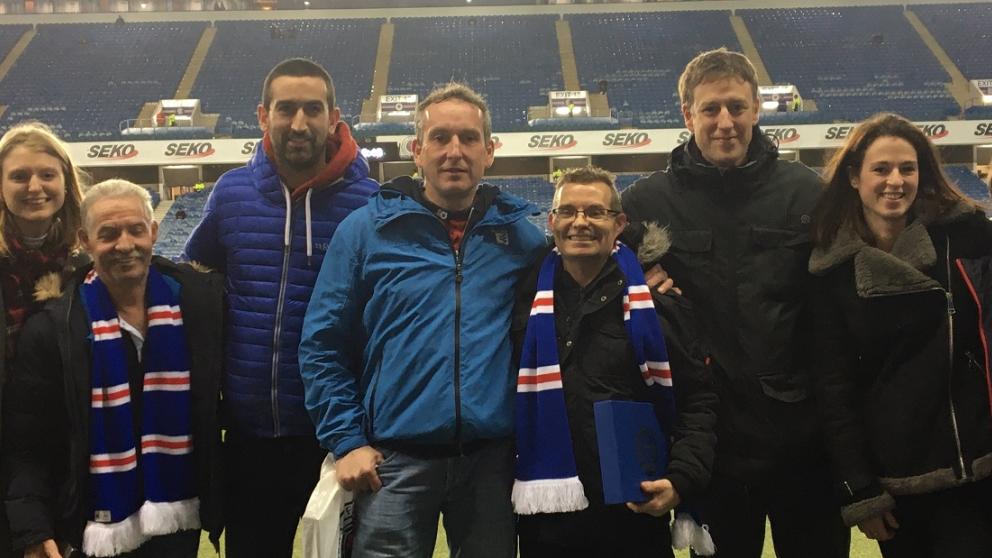 Group of people together on a football field