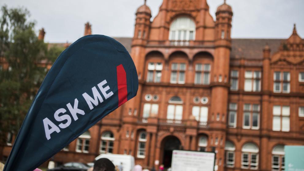 Peel hall in the background with ask me sign