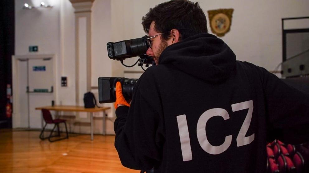 A camera operator capturing a scene