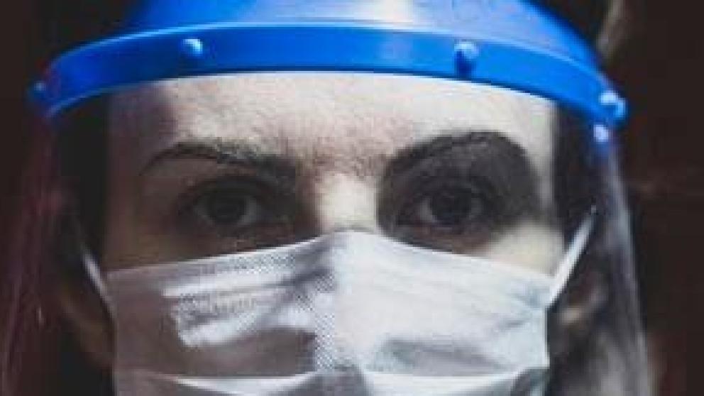 Woman wearing PPE visor
