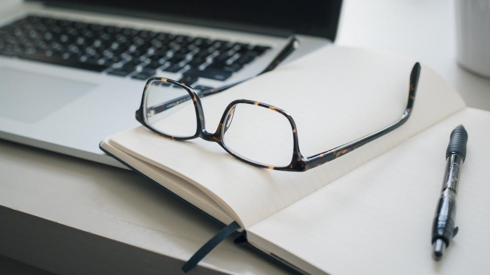 Laptop, book and glasses