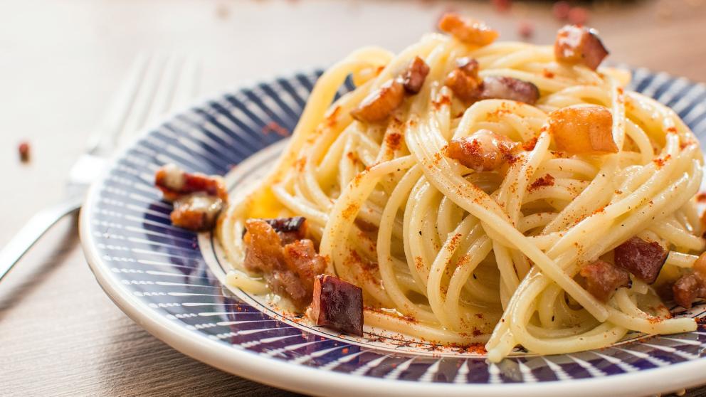 Cutlery and a plate of pasta