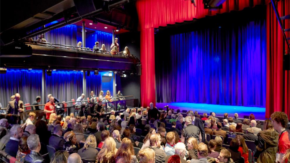Seated audience about to watch a performance in the New Adelphi Theatre, University of Salford