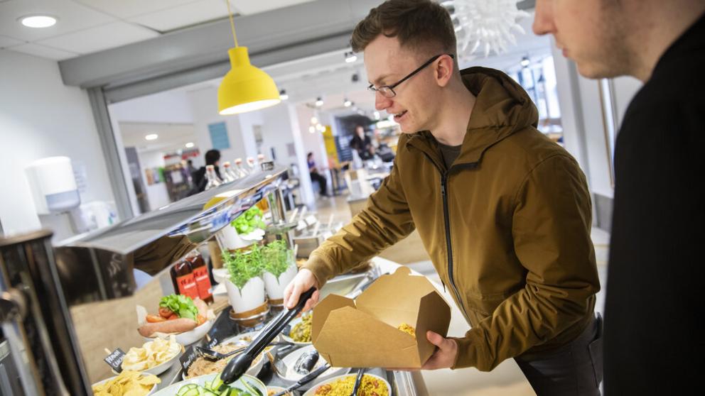 Students buying food in Maxwell Café, University of Salford
