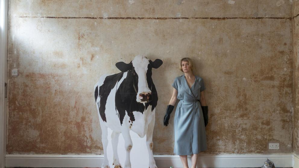 Graduate Lasma Poisa art installation with life-size cow cutout