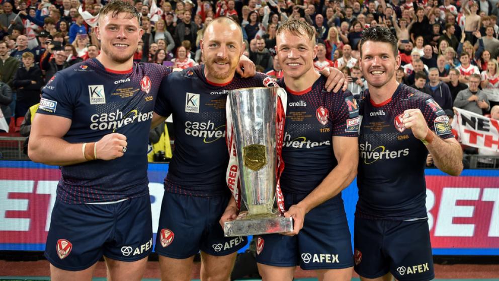 Salford student Jonny Lomax holding the super league trophy