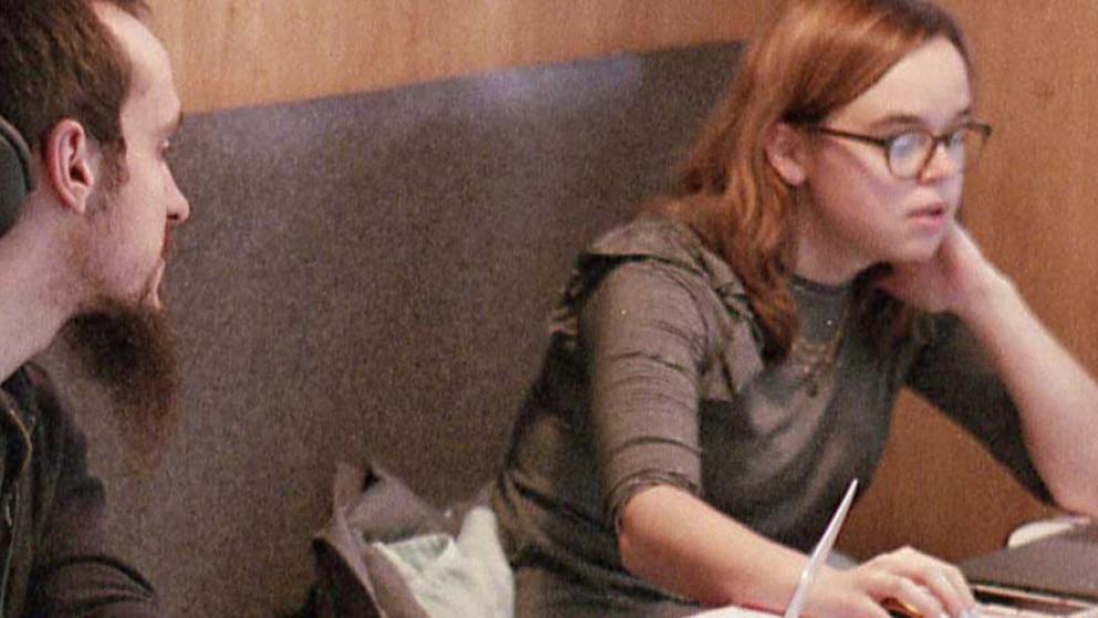 Students studying in a booth in the Library