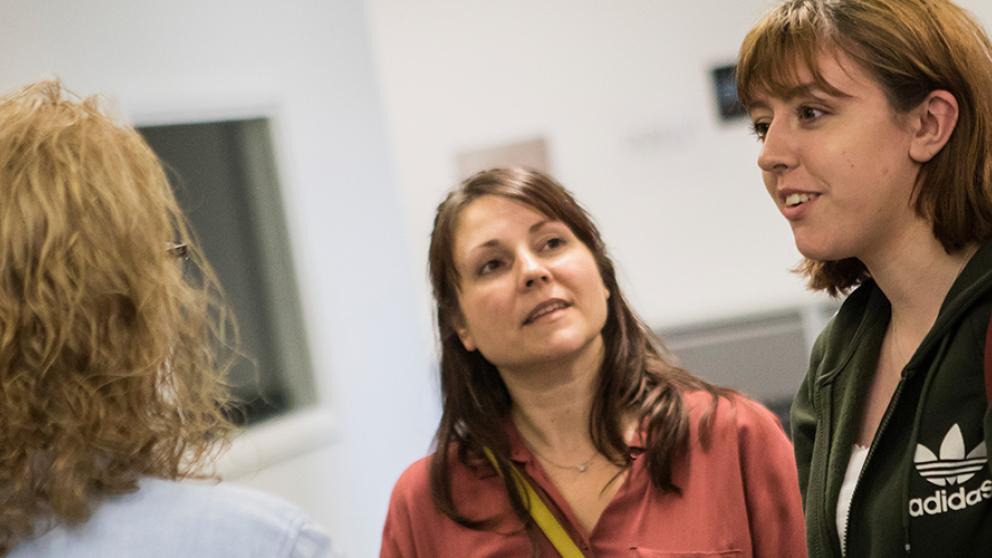 Three members of support staff in conversation